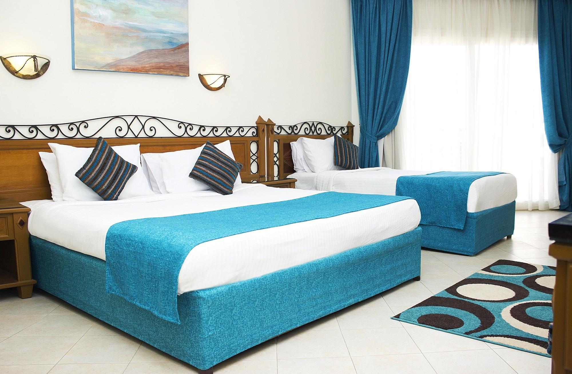 Pyramisa Beach Resort Sahl Hasheesh Hurghada Buitenkant foto A bedroom in a hotel